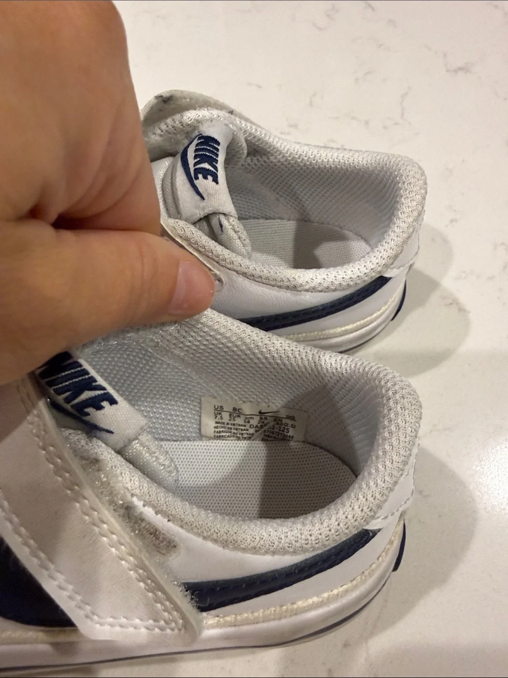 Nike Kids White Sneakers with Navy Swoosh and Velcro Strap